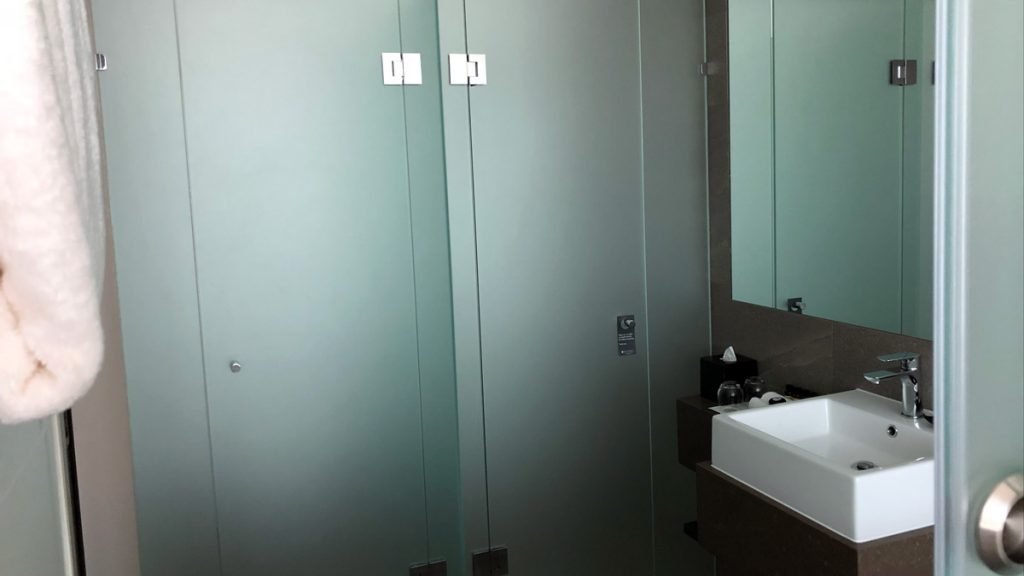 a bathroom with glass doors