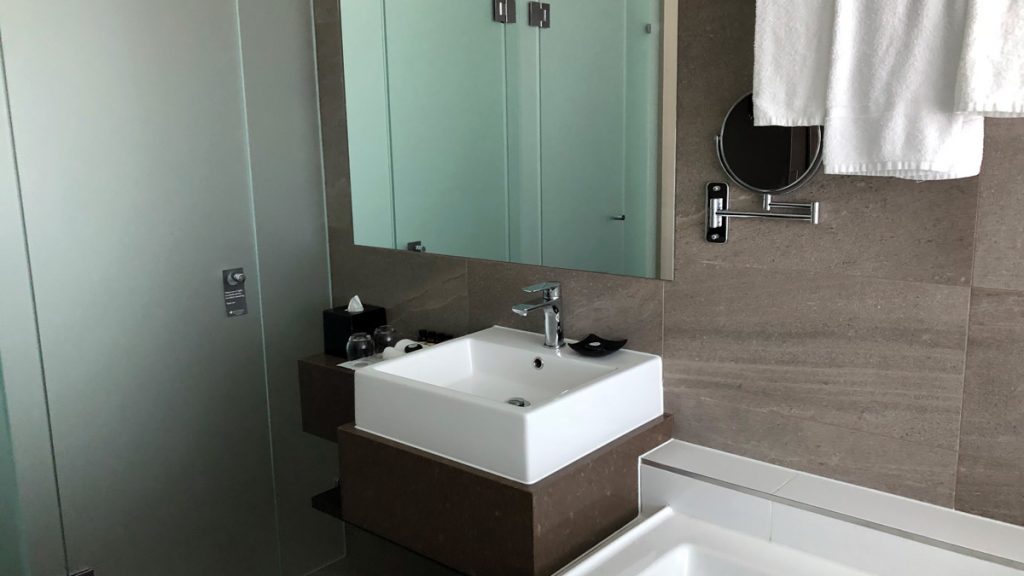 a bathroom with a sink and mirror