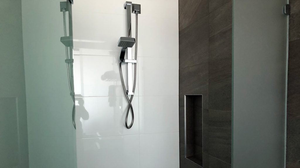 a shower head in a bathroom