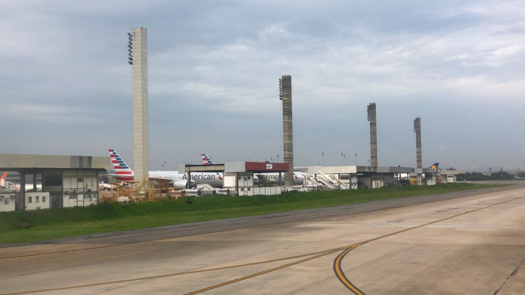 an airport with airplanes and a building