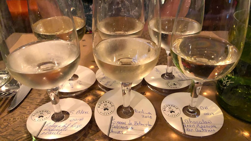 a group of wine glasses on coasters