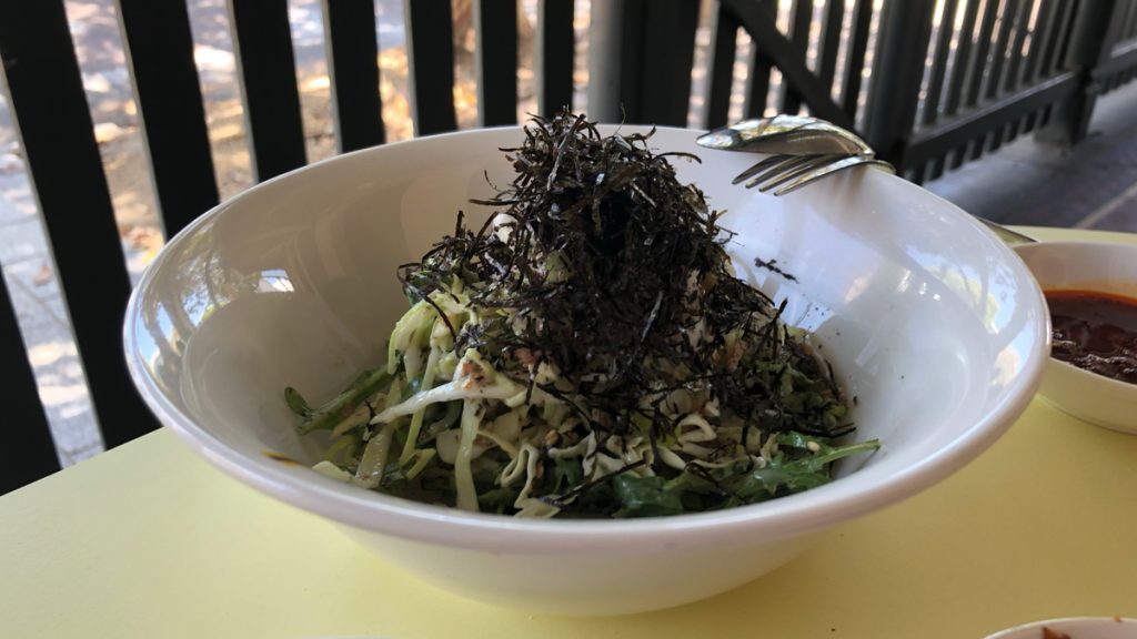 a bowl of salad with a fork