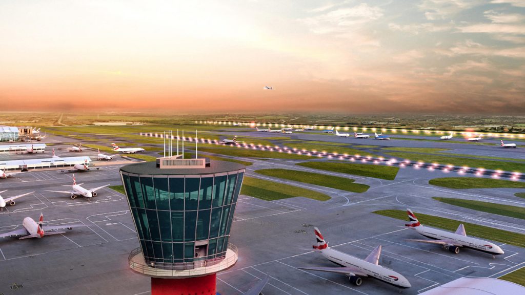 an airport with a tower and airplanes