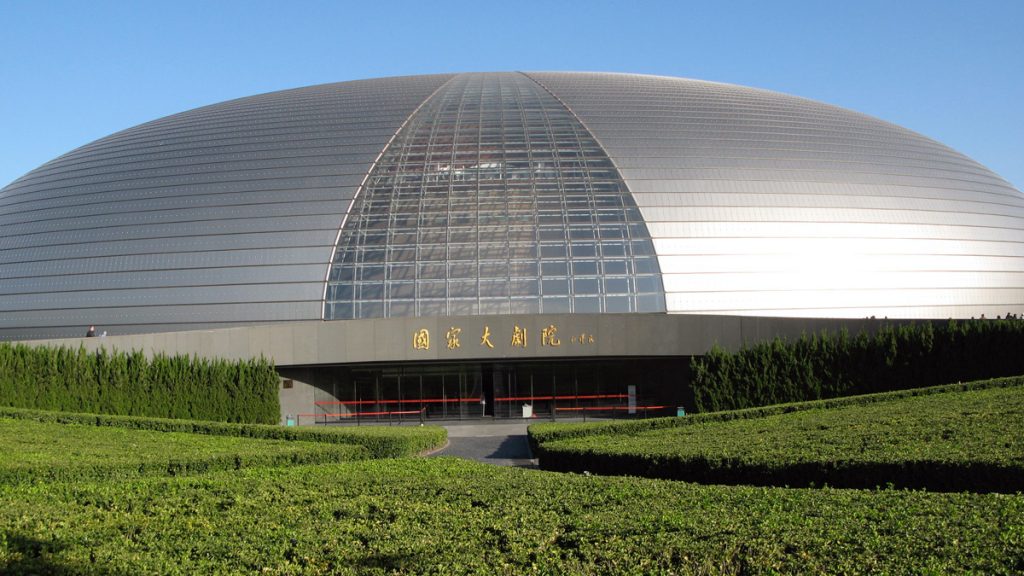 a large circular building with a circular roof