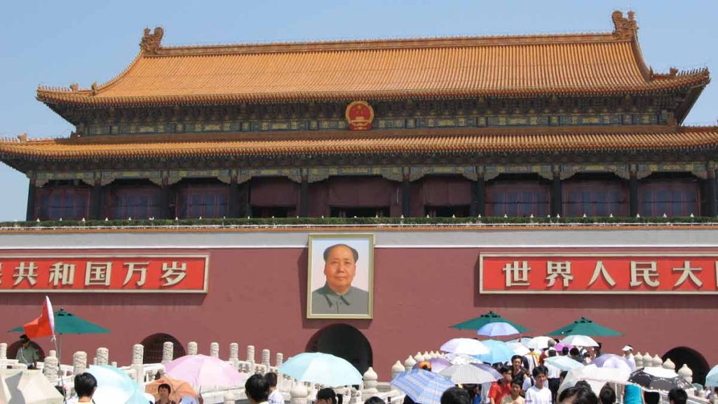 a large building with a portrait of a man