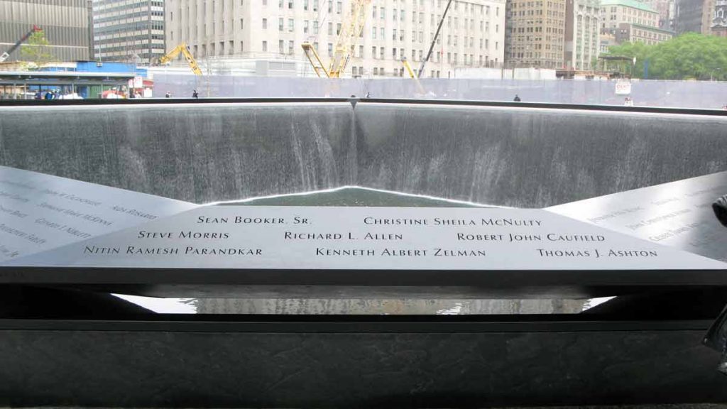 a memorial with names on the ground