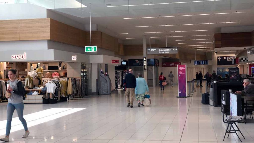 people walking in a large airport