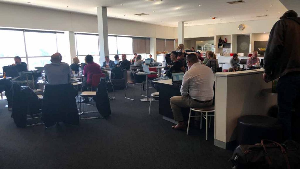 a group of people sitting at tables in a room