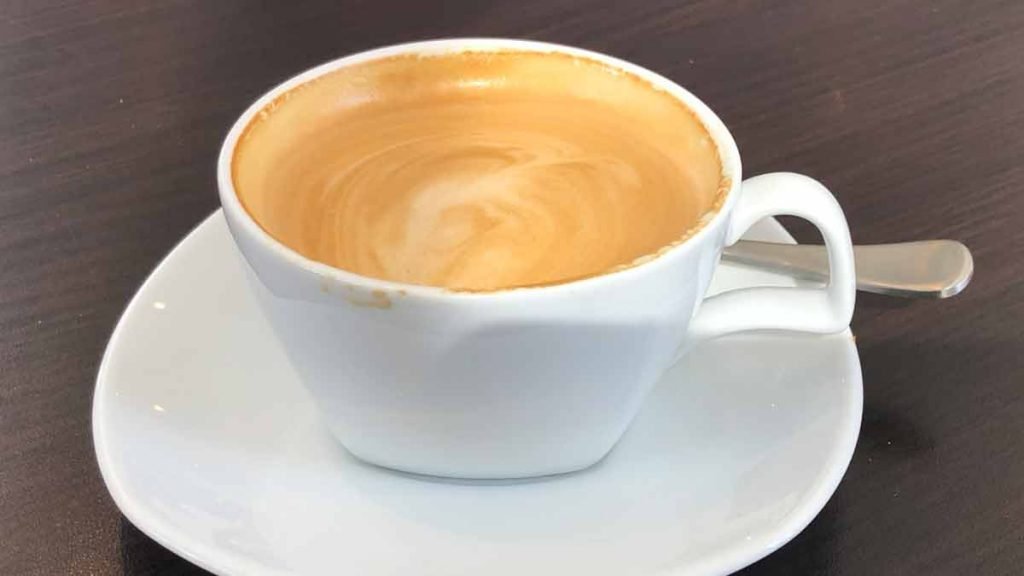 a cup of coffee on a saucer