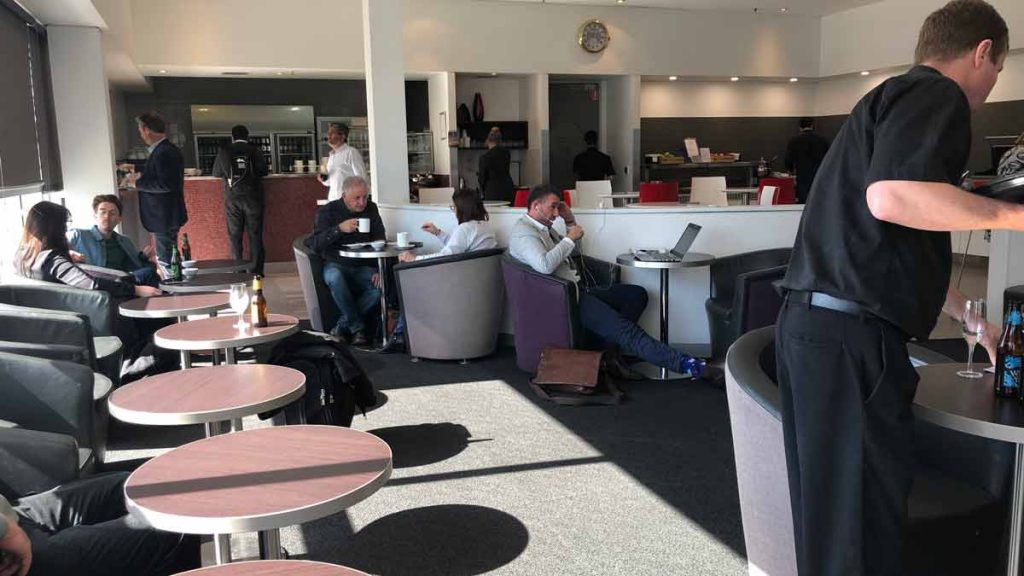 a group of people sitting at tables in a room