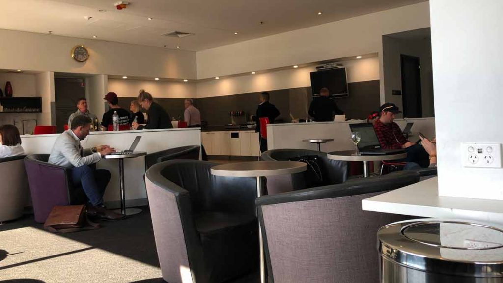 a group of people sitting at tables in a room