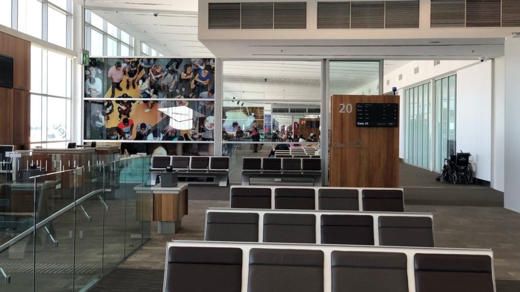 a room with chairs and a large screen