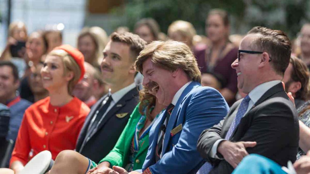 a group of people sitting in a row