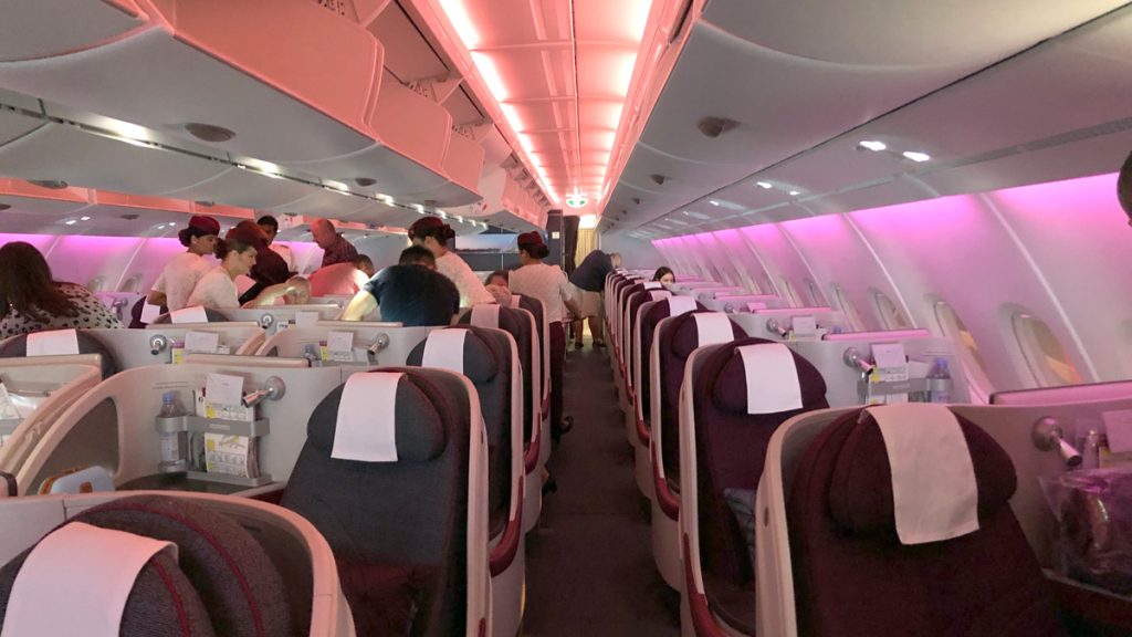 a group of people sitting in an airplane