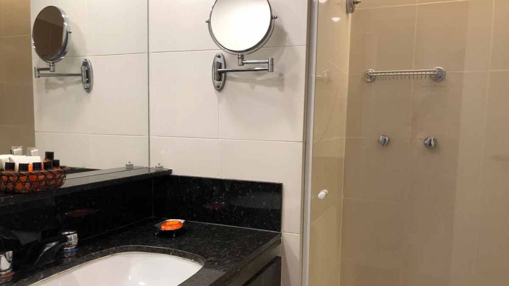 a bathroom with a mirror and sink