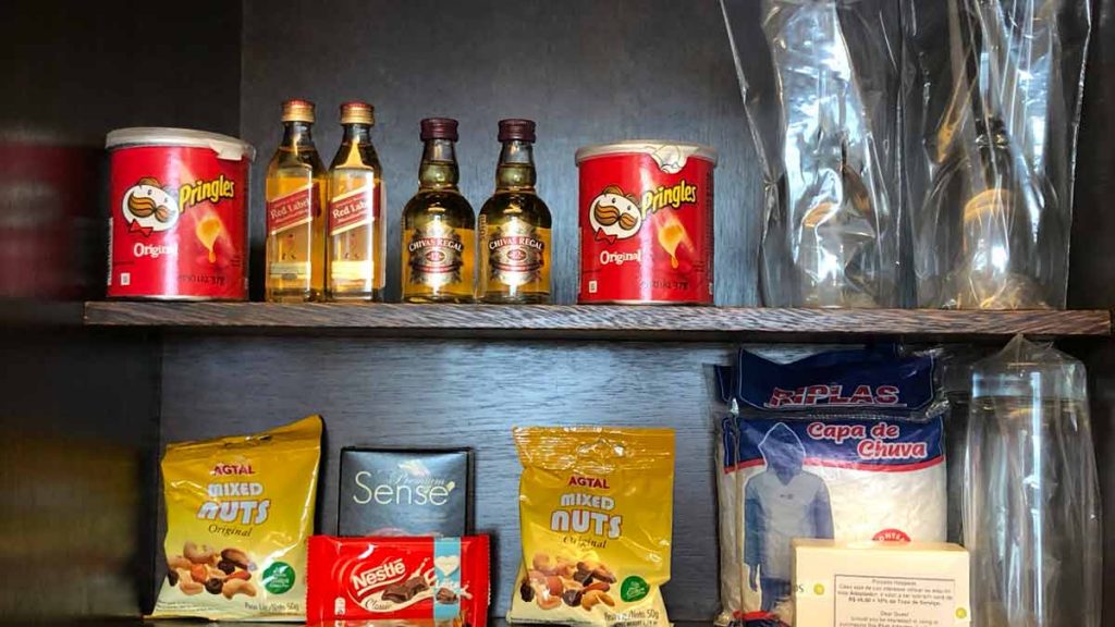 a shelf with food and drinks on it