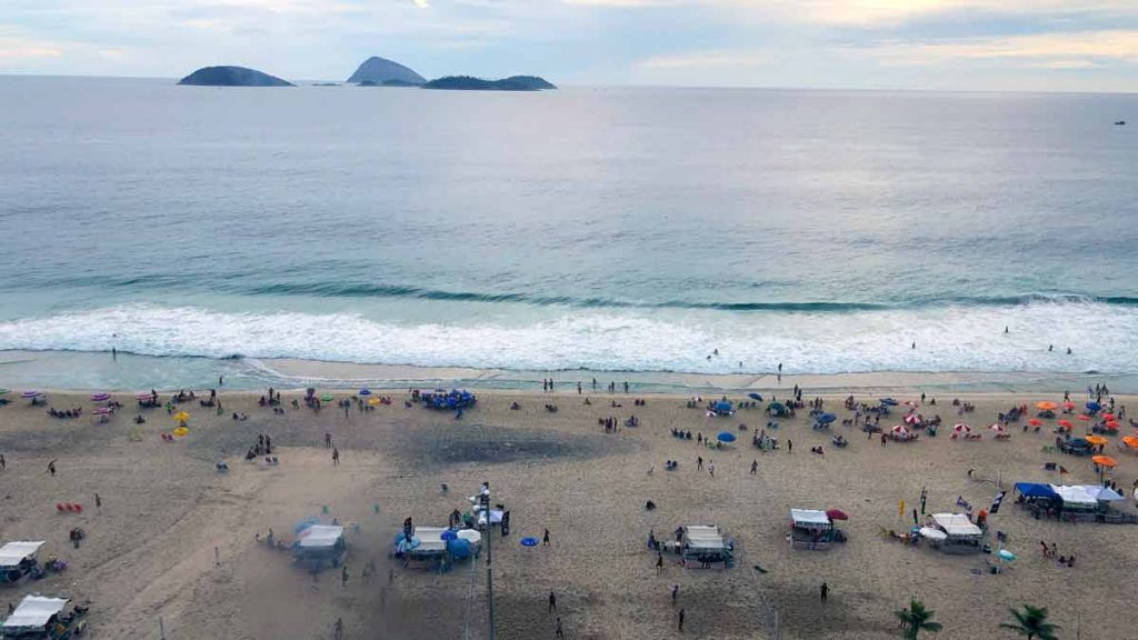 a beach with people and water