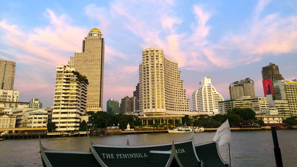 a city skyline with boats and buildings