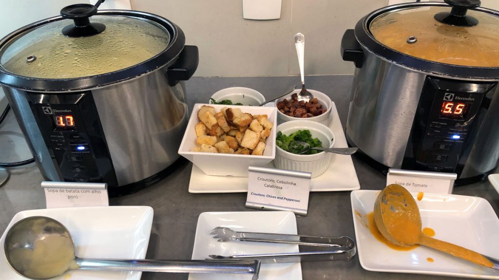 a table with crock pot and food