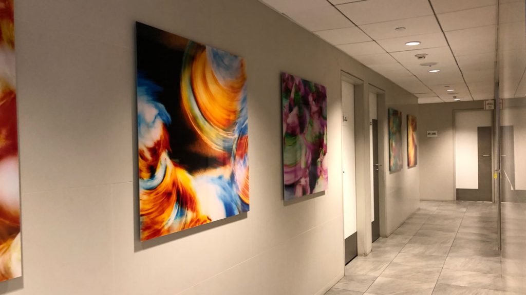 a hallway with art on the wall