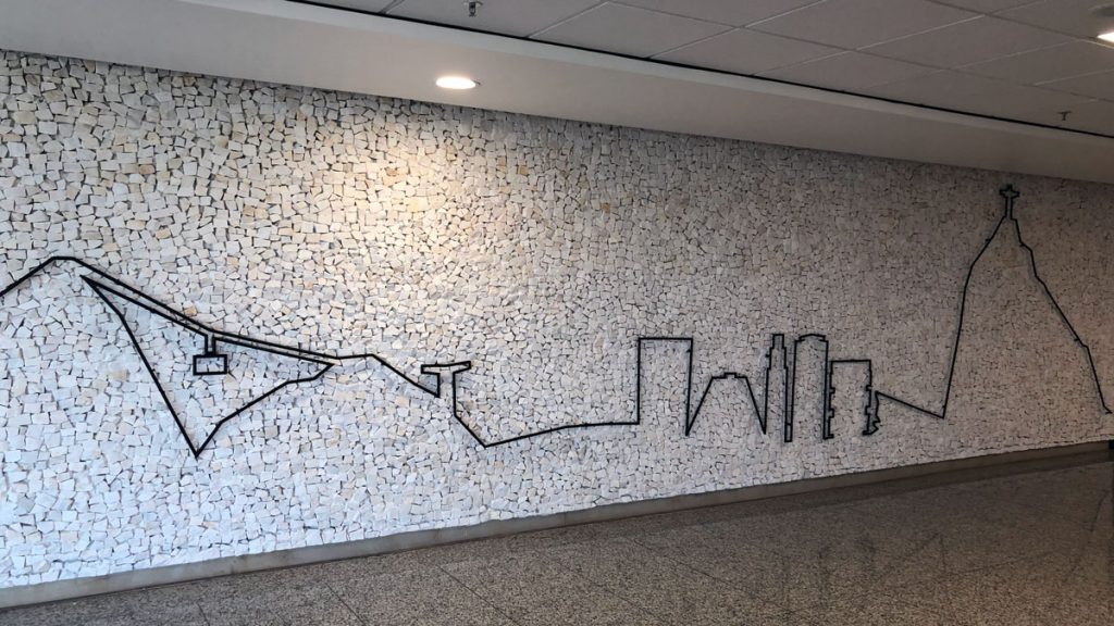 a wall with a drawing of a city