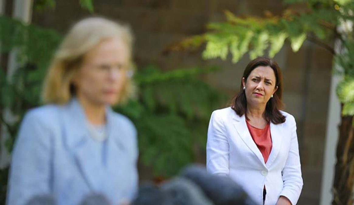 a woman in a white suit