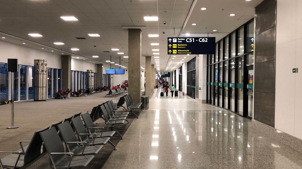 a group of people walking in an airport