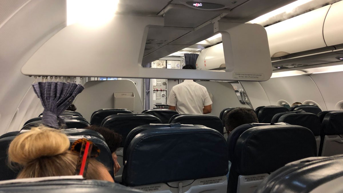 a person standing in an airplane
