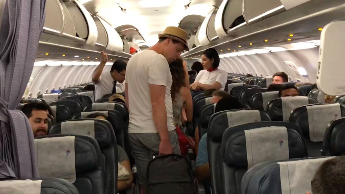 a man and woman in an airplane