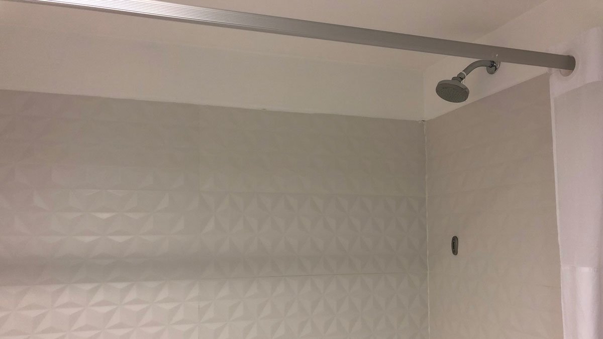 a shower head in a bathroom