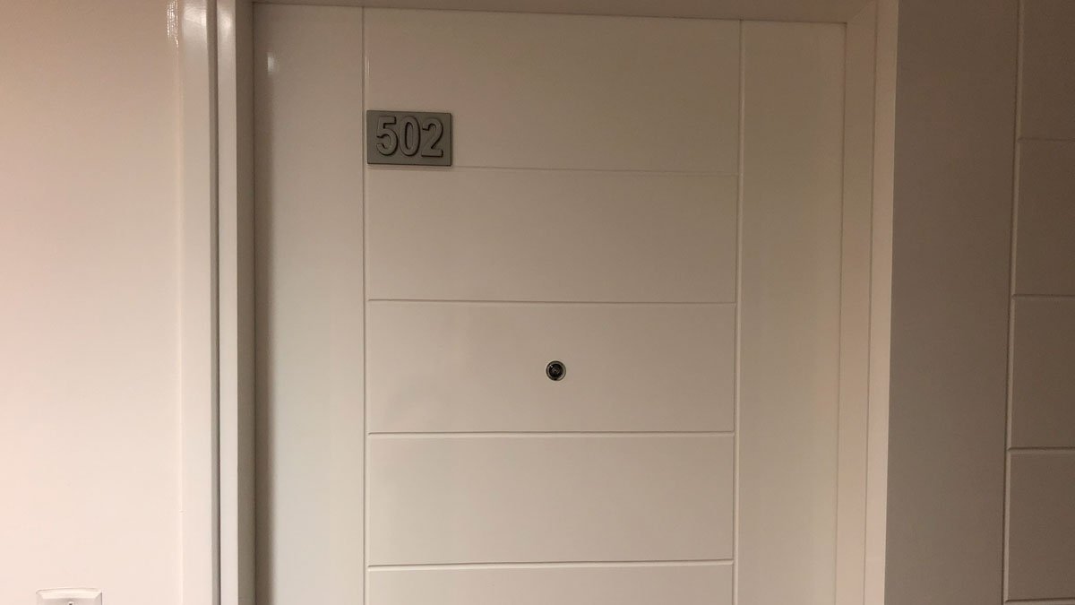 a white door with a number on it