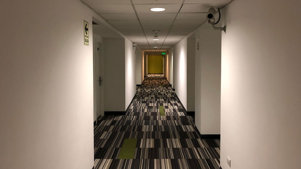 a hallway with a carpeted floor