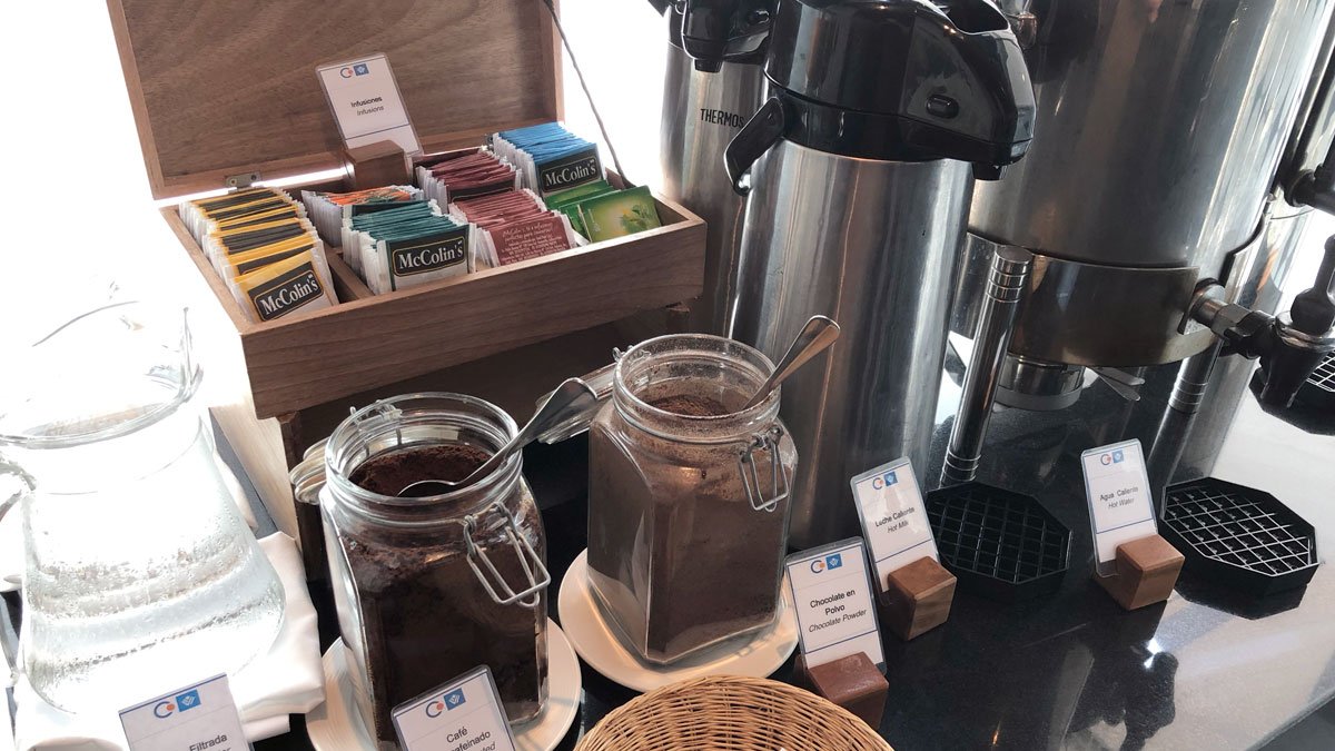 a coffee maker and jars of coffee