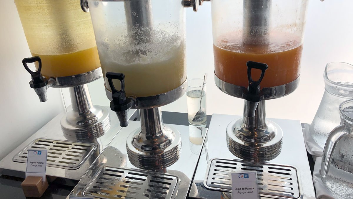 a group of juice dispensers