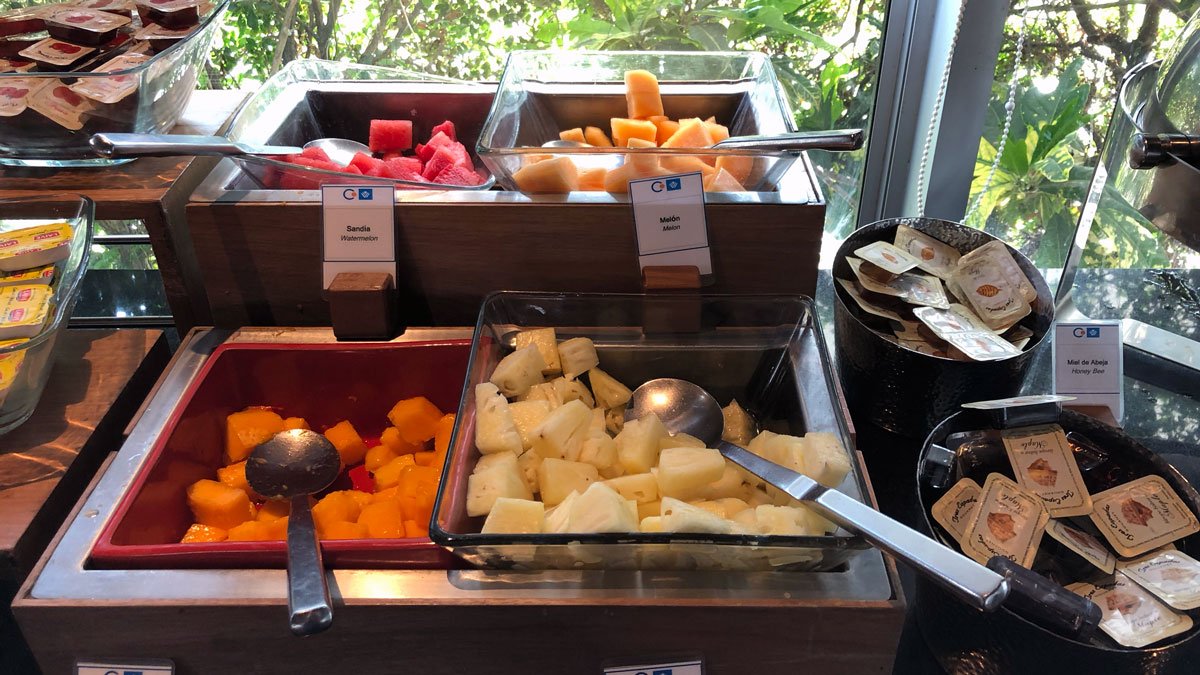 a buffet with fruit in bowls