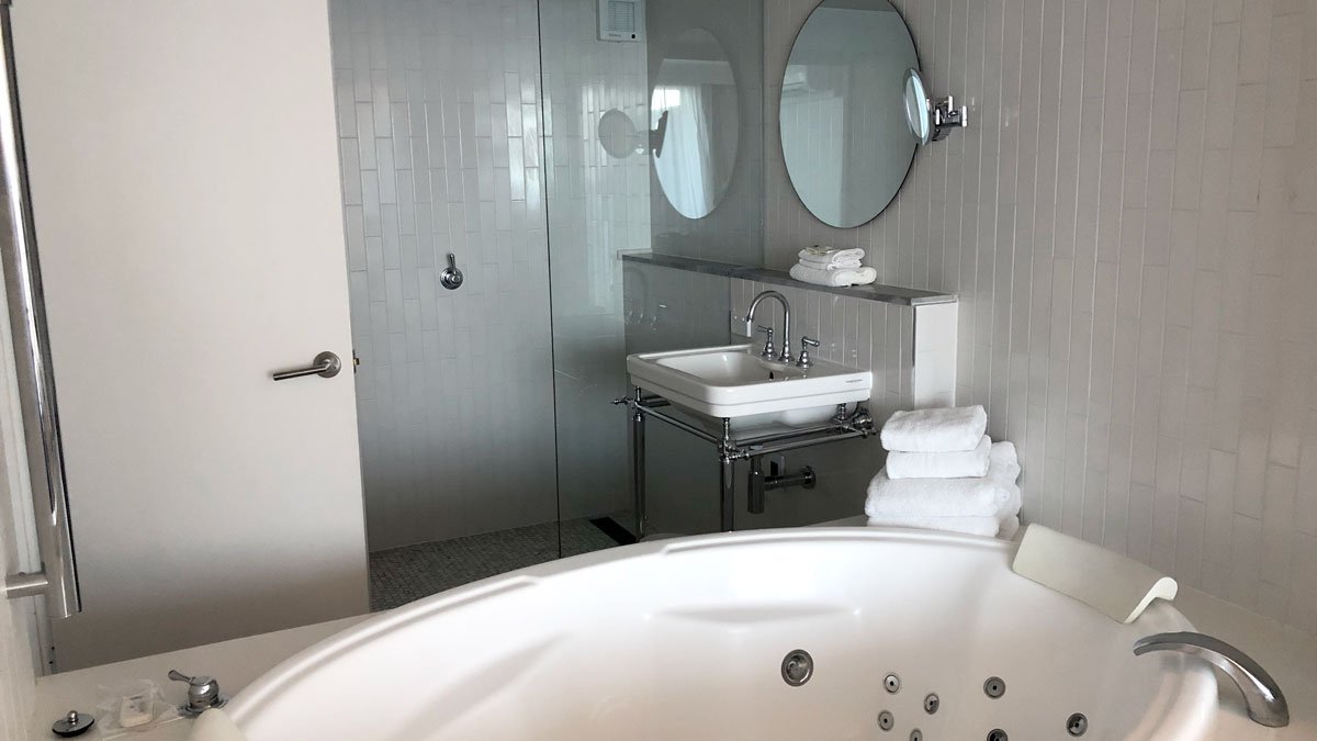 a bathroom with a tub and a sink