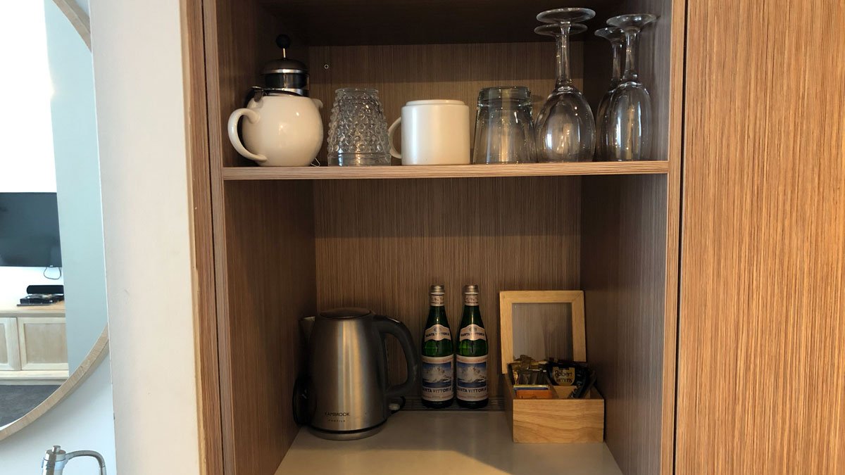 a shelf with glasses and cups on it