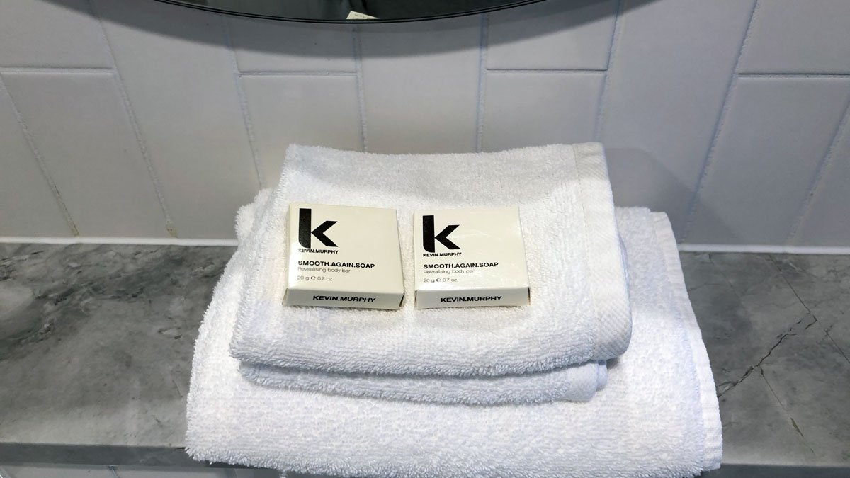 a white towels with black letters on them