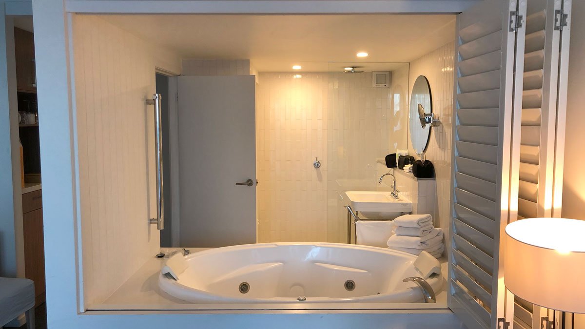 a bathroom with a large tub and sink