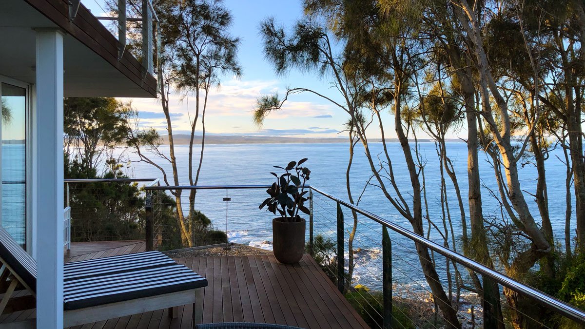 a deck with a view of the ocean