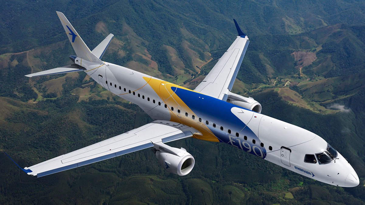 a plane flying over a valley