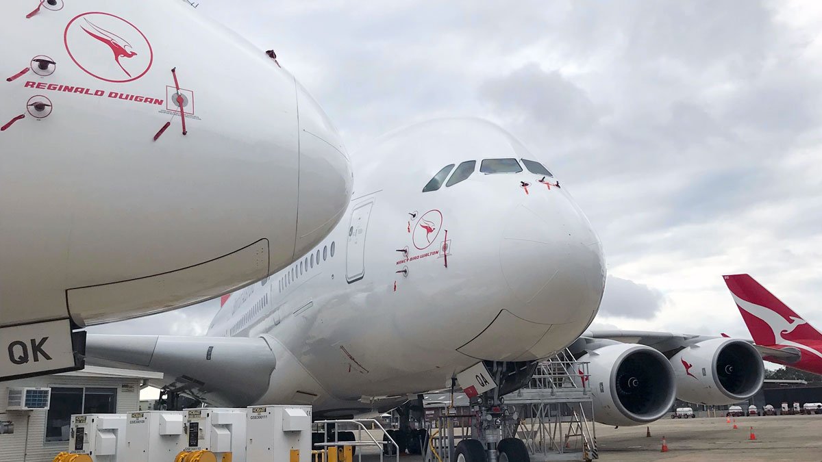 a large white airplane with two engines