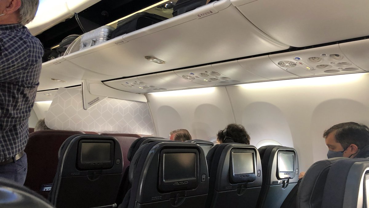 a group of people sitting in an airplane