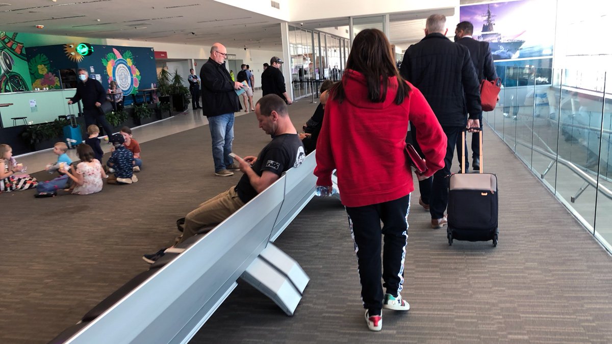 a group of people in an airport