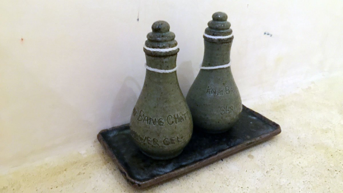 a couple of ceramic bottles on a tray
