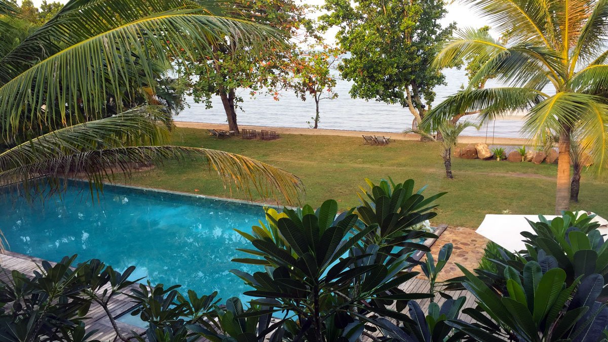 a pool next to a body of water