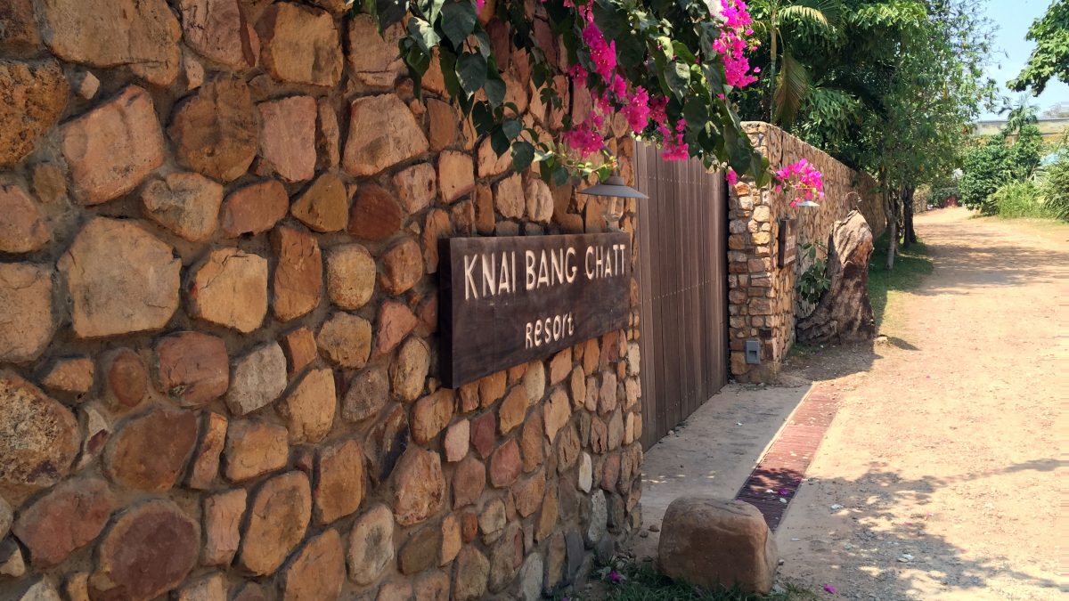 a sign on a stone wall