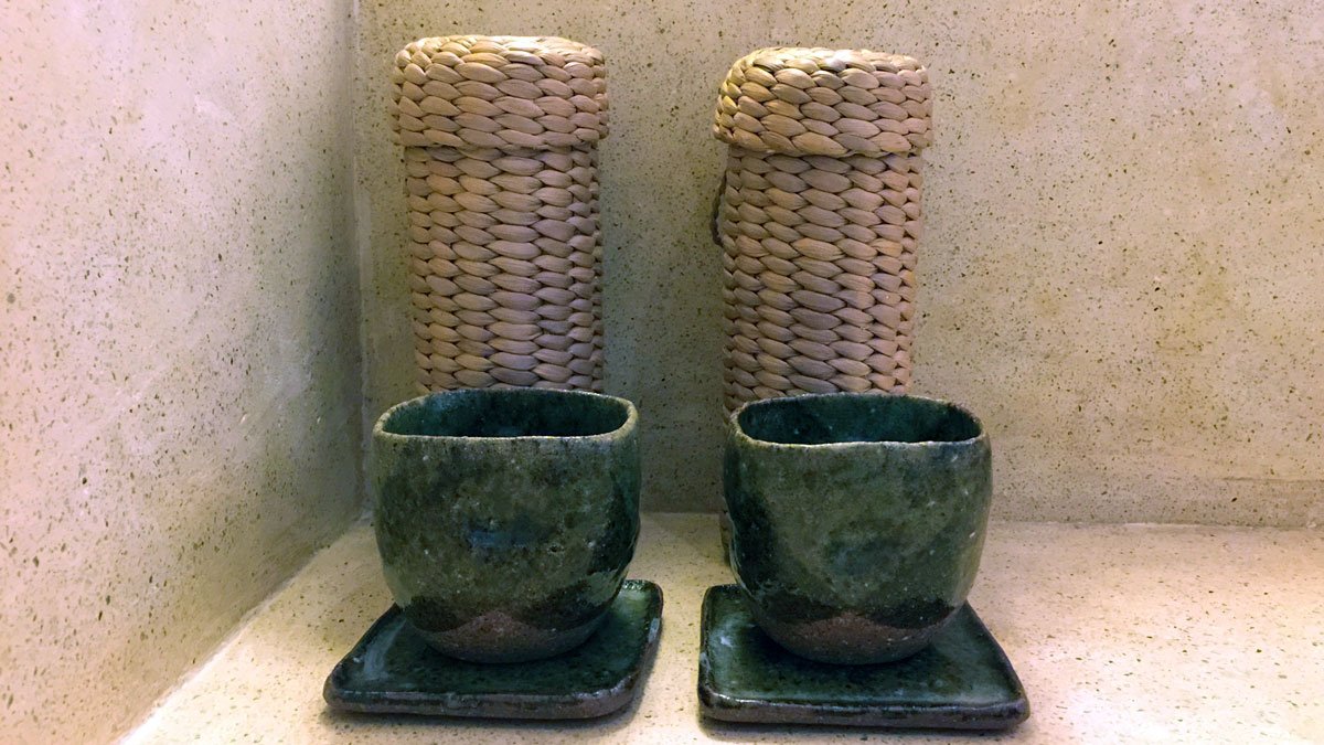 a group of cups and saucers on a counter