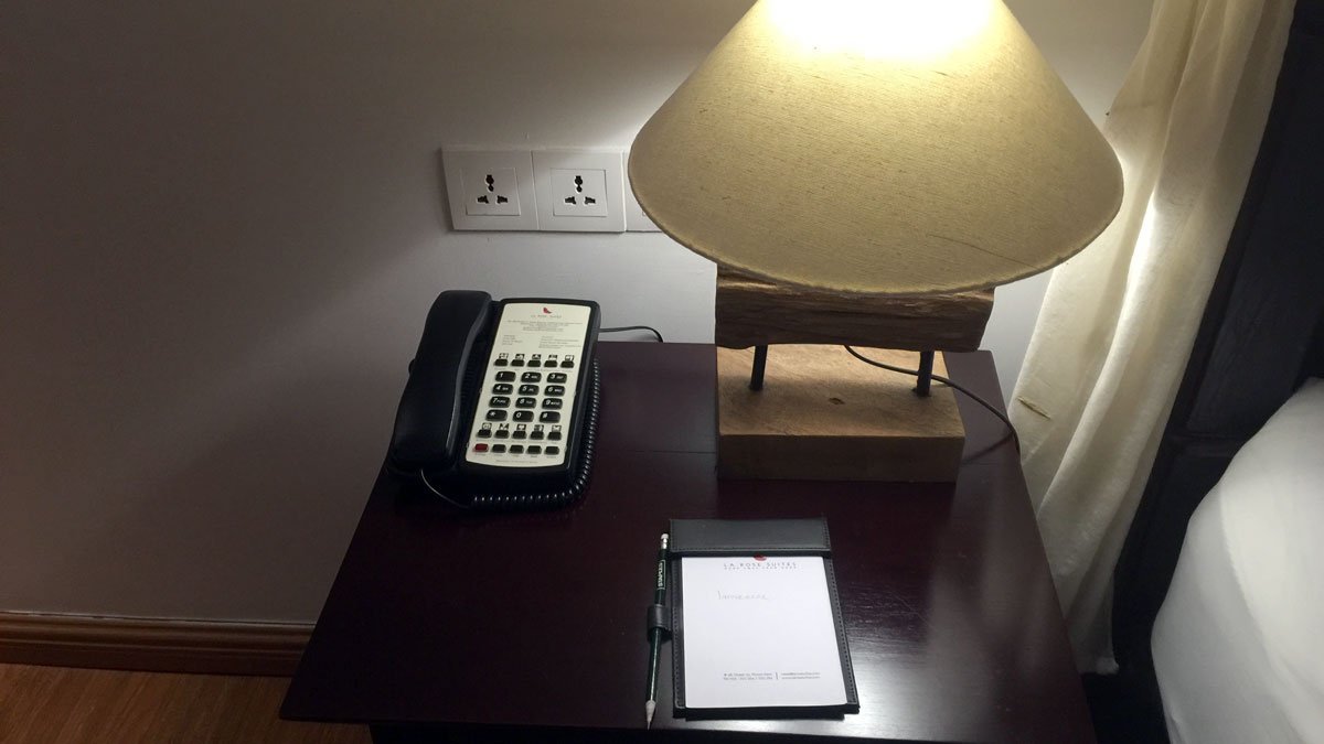 a telephone and notepad on a desk