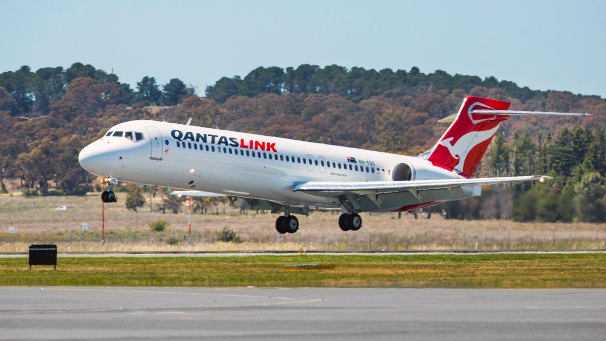 a white airplane taking off